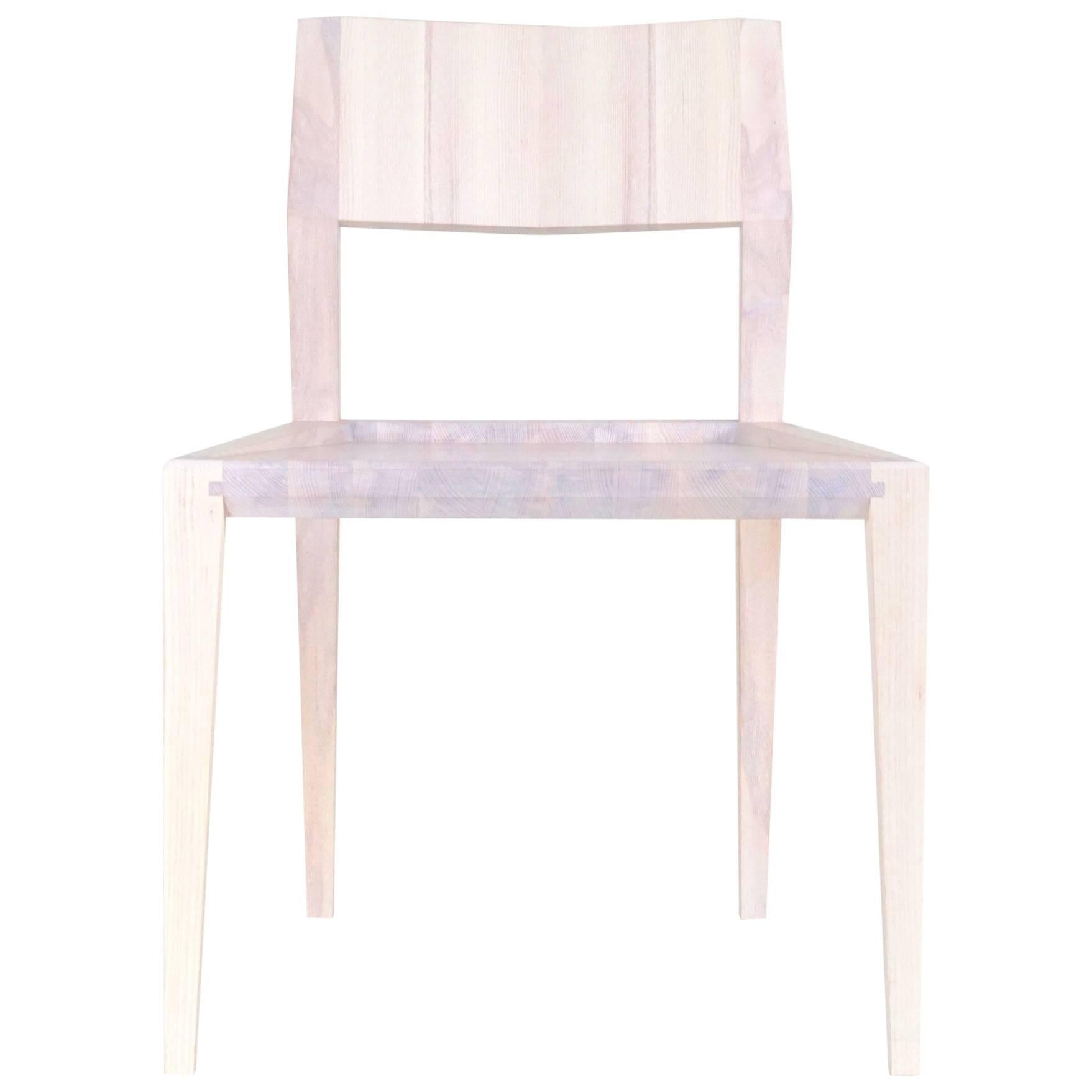 White Armless Contemporary Ash Chair with Faceted Legs and Seat Back For Sale