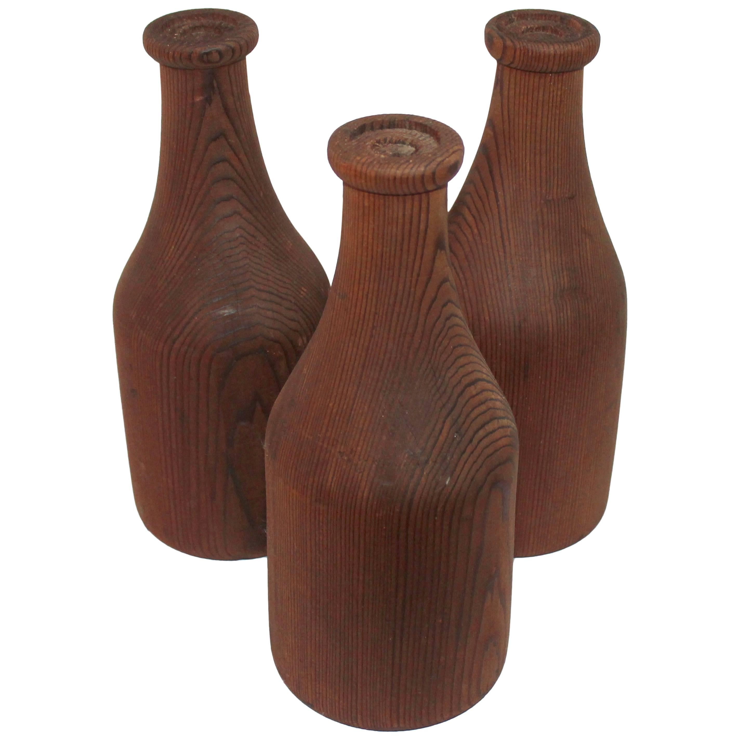 Group of Three Folky Wood Carnival Milk Bottles For Sale