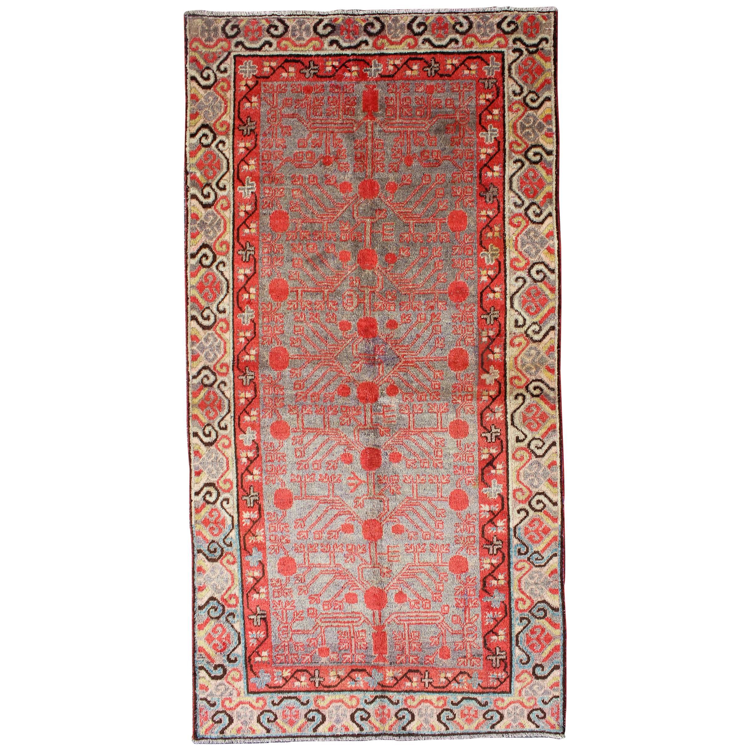 Intricate Vintage Khotan Rug with Sub-Geometric Design in Reds and Light Blue