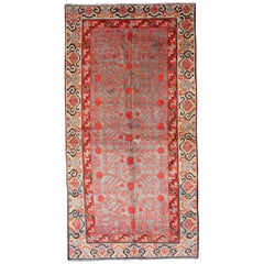 Intricate Vintage Khotan Rug with Sub-Geometric Design in Reds and Light Blue