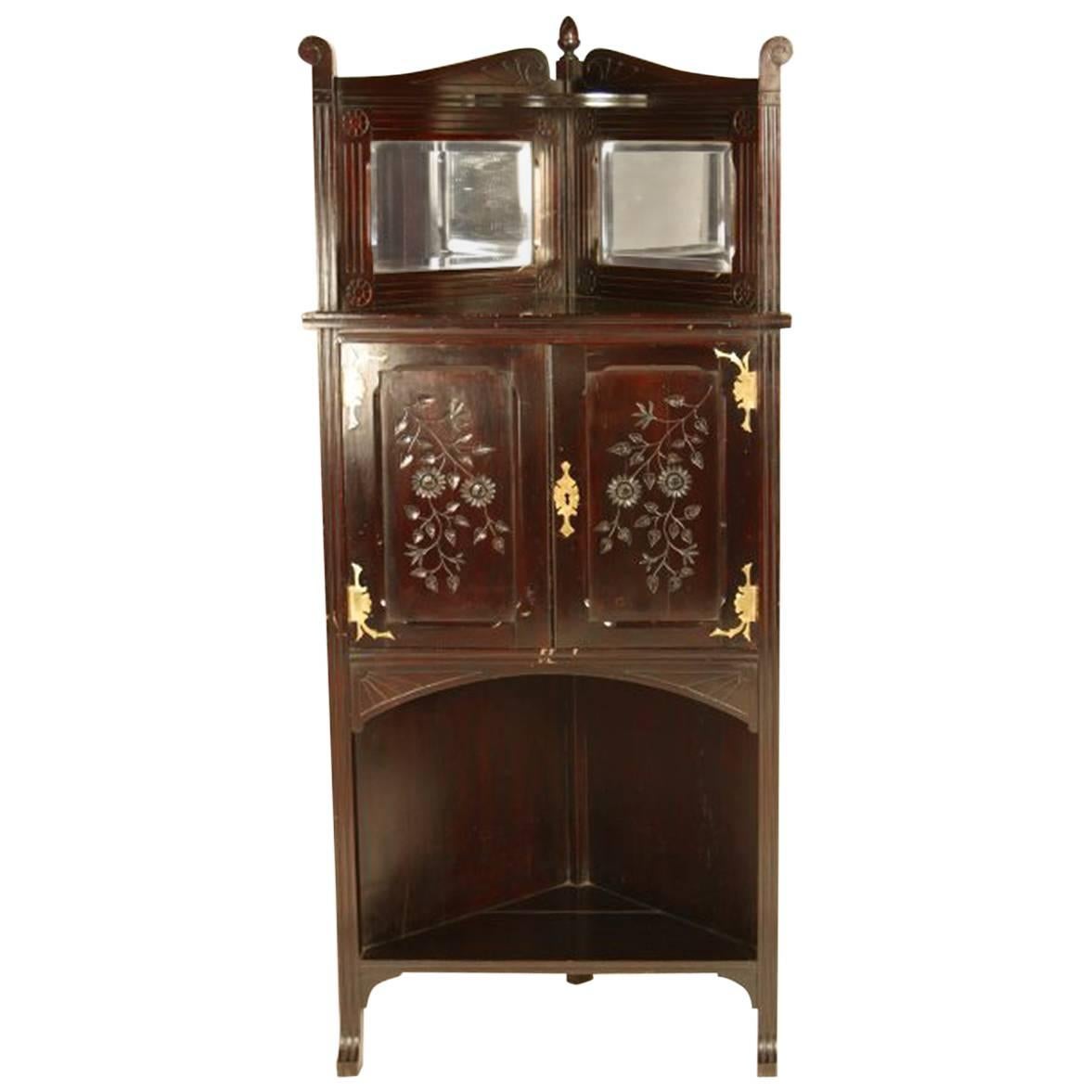 An Aesthetic Movement Mahogany Corner Cabinet with Incised Floral Decoration