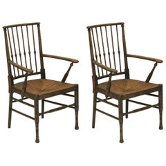 Two Liberty and Co Egyptian Style Thebes Rush Seated Armchairs