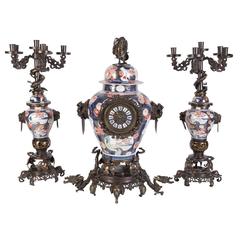 Antique French Japonisme Parcel-Gilt Patinated Bronze Imari Porcelain Clock Garniture