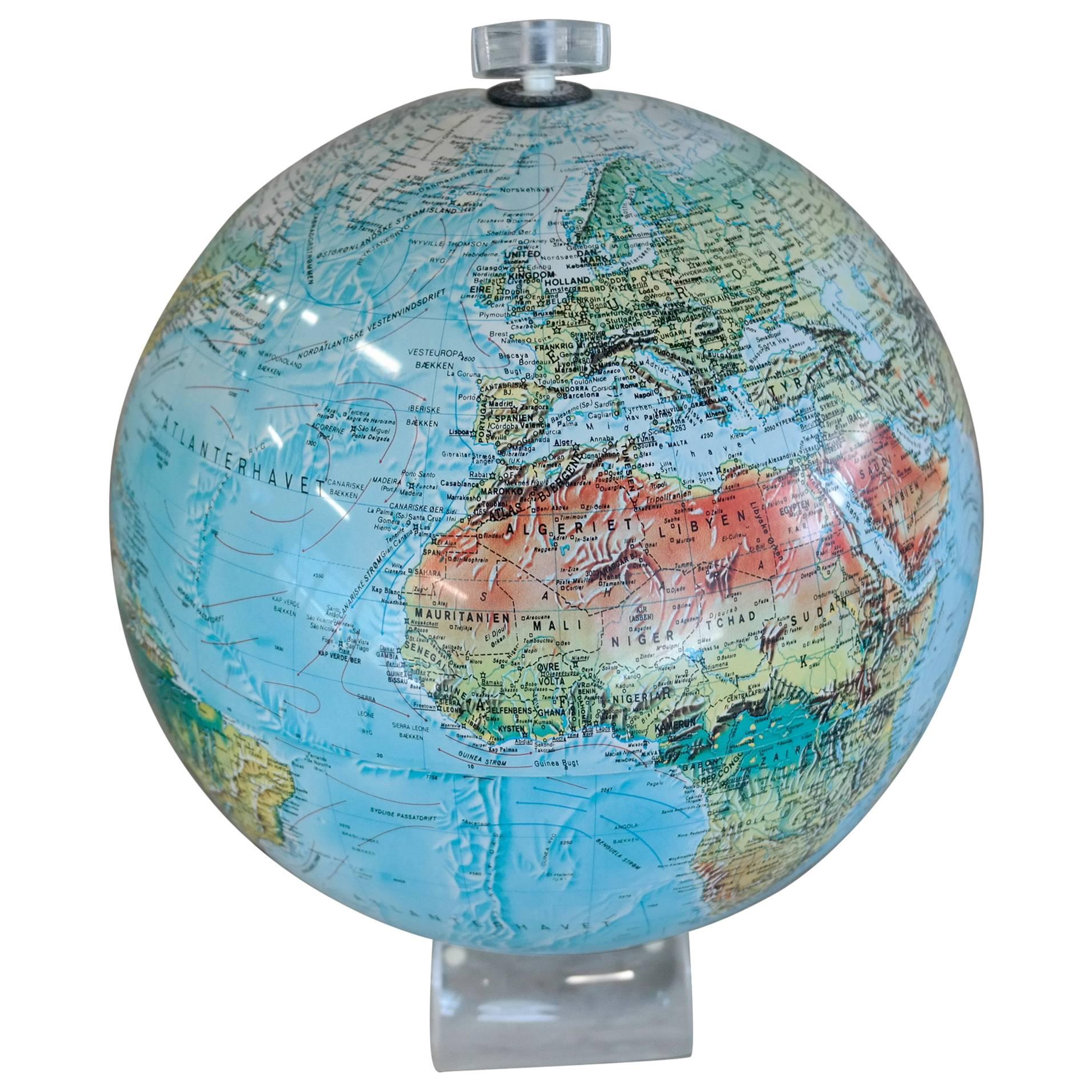 Very cool 1960 Lucite globe. The globe is lighted and in excellent condition. We have seen two or three of these over the years coming out of Europe but we are not familiar with the name of the manufacturer. Imported from Denmark.