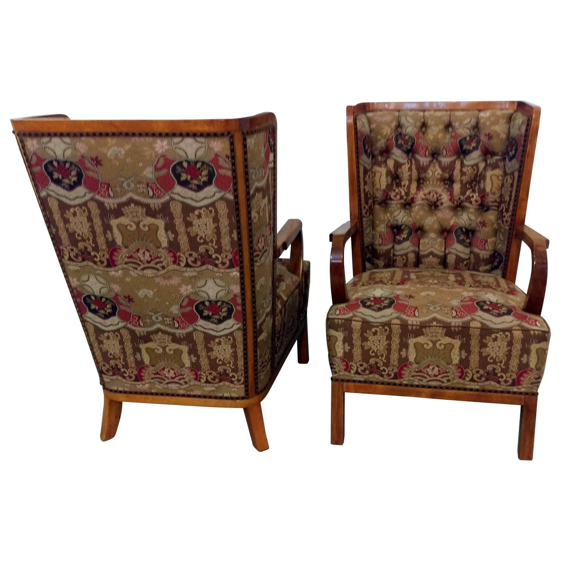 Fabulous pair of stylish and extremely comfortable wingback lounges. Masterfully crafted wood framed, upholstered in French silk jacquard, deep cushion seat with buttons tufted. Very rare of this exceptional quality and style. Attributed to Jules