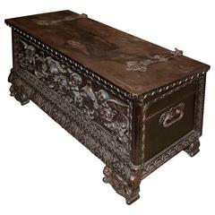 19th Century Baroque Heavily Carved Trunk with Hand-Forged Iron