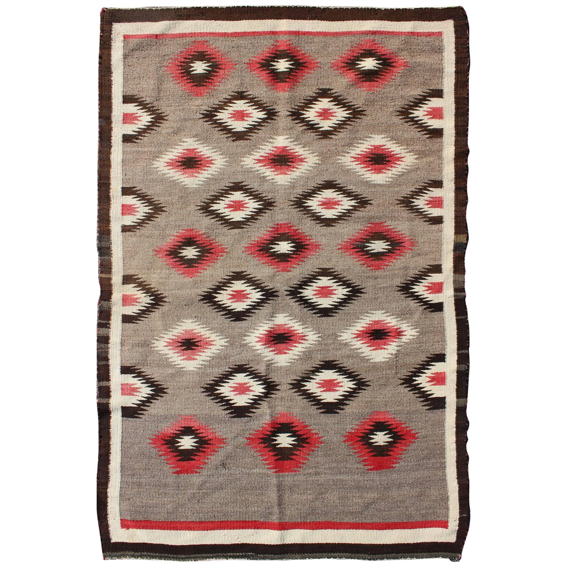 American Navajo Rug with Geometric All-Over Design in Reds and Browns For Sale