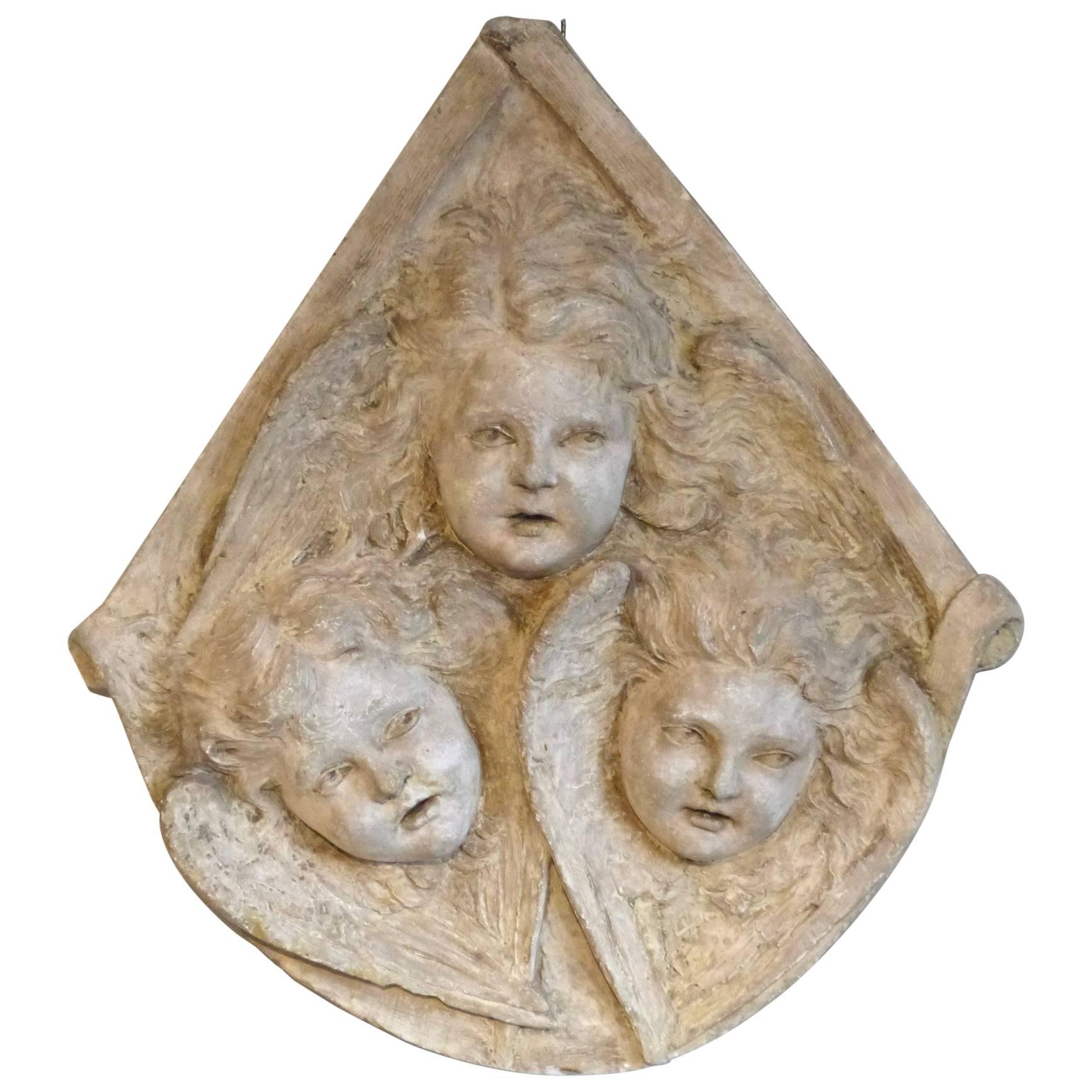 Plaster Relief of three Putti For Sale