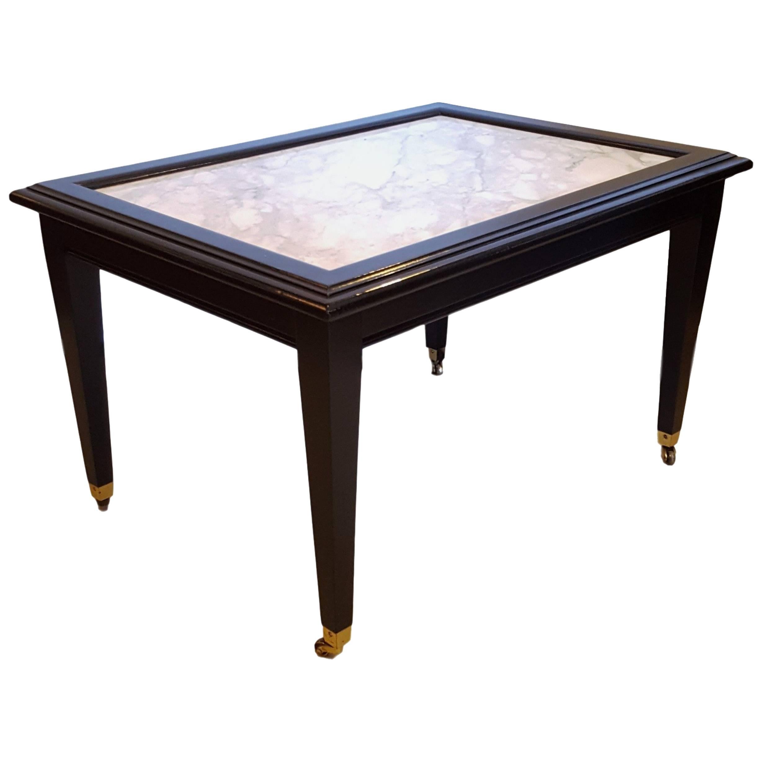 Ebonized Marble Top Coffee Table / Cocktail Table On Wheels manner of Jansen For Sale
