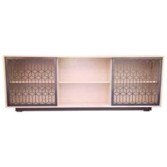 Morales Media Console in Bone Maple with Natural Steel Bypass Doors and Base