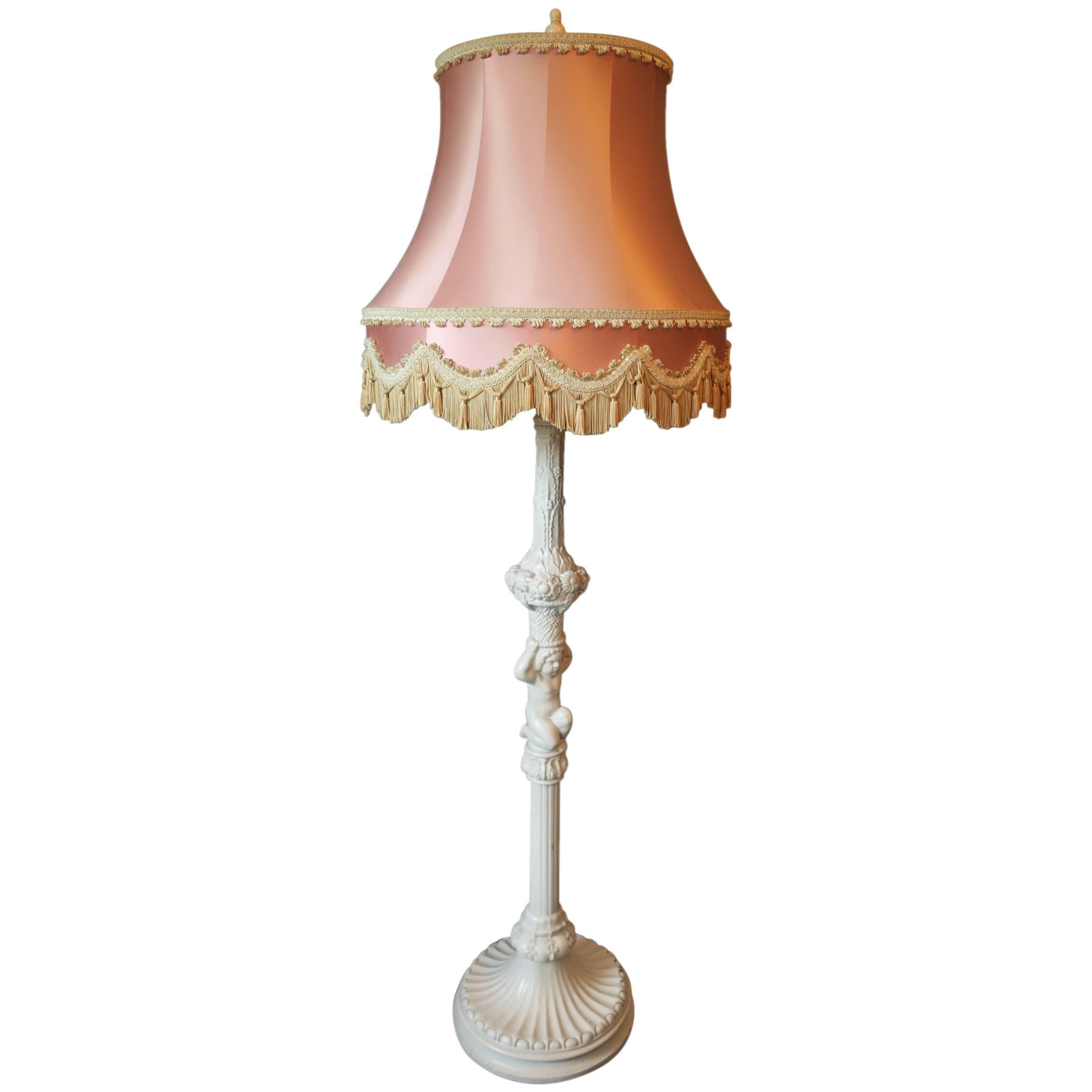 Carved and Painted Wood Floor Lamp Held by Putto with Original Silk Shade For Sale