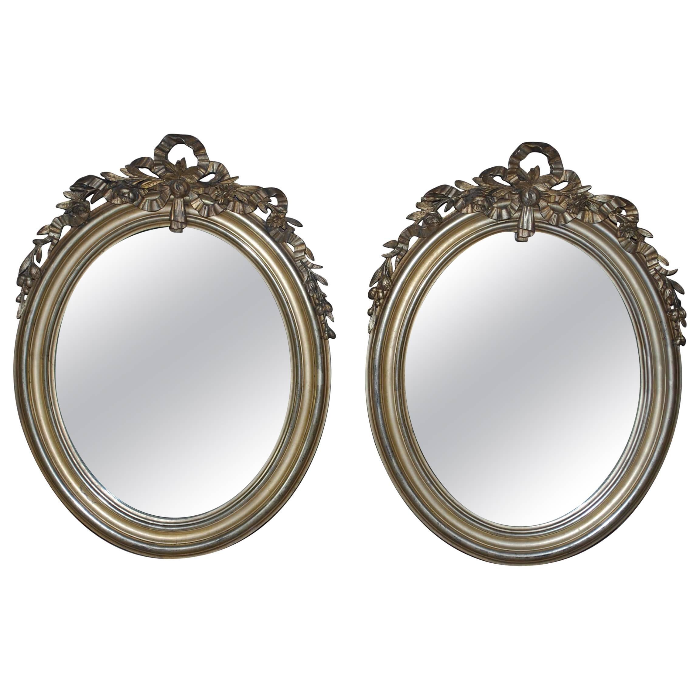 Pair of 19th Century Silver Gilded Oval Mirrors