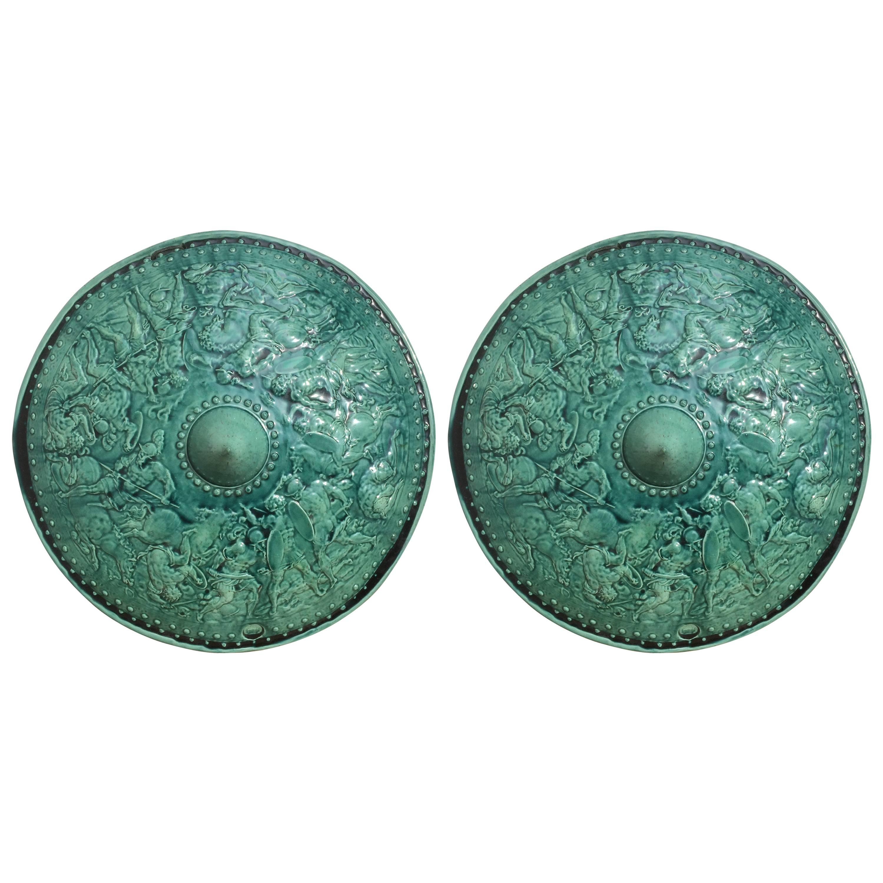 Pair of Turquoise Majolica Parade Shields with Battle Scenes, 19th Century