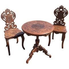 Pair of Antique Black Forest Hall Chairs and Matching Table, Late 19th Century