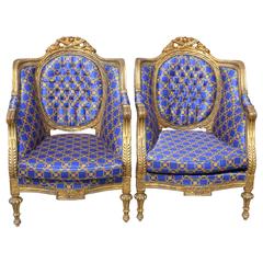 Pair of French Louis XVI Style Richly Carved Giltwood Armchairs, circa 1890-1900