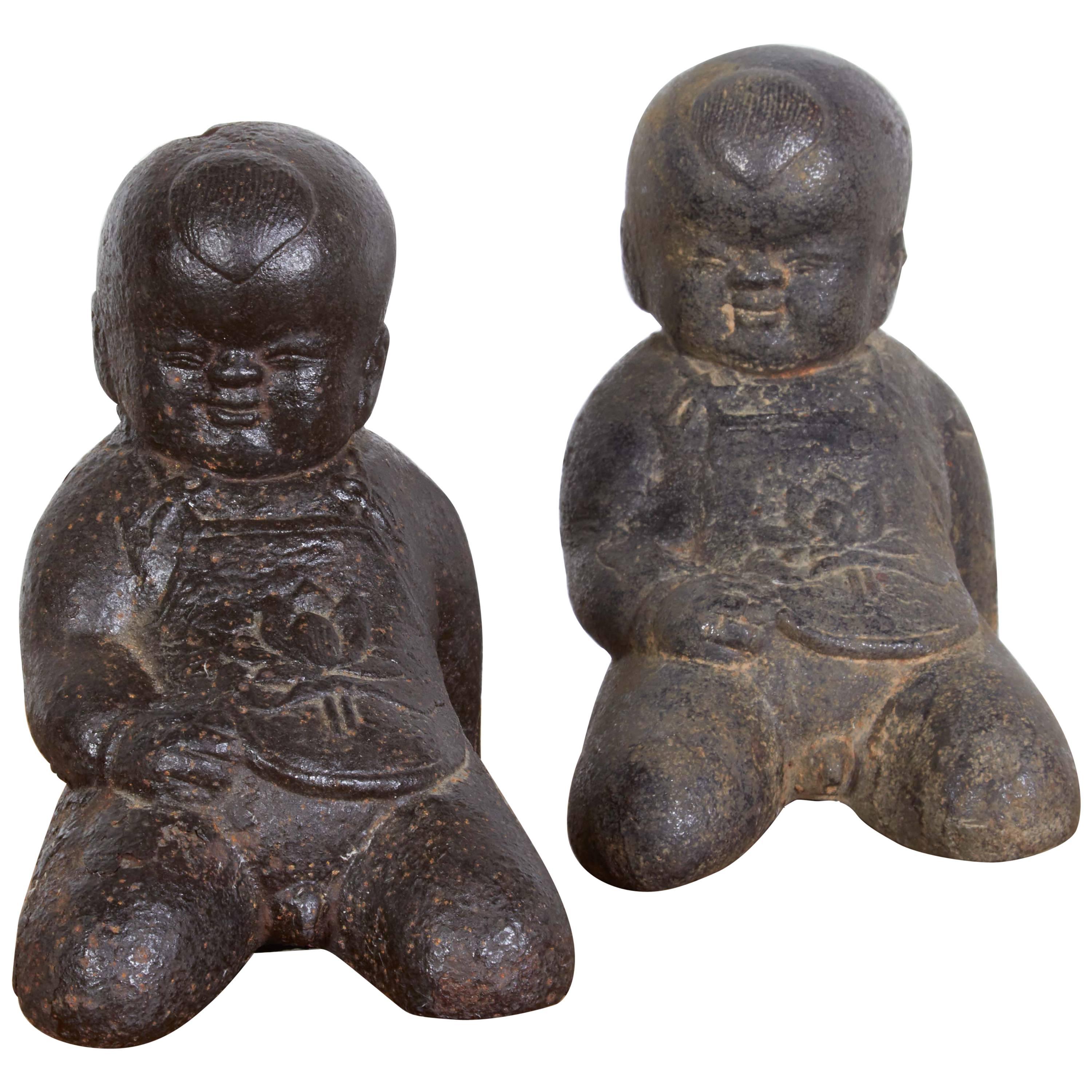 Pair of Adorable Cast Iron Babies