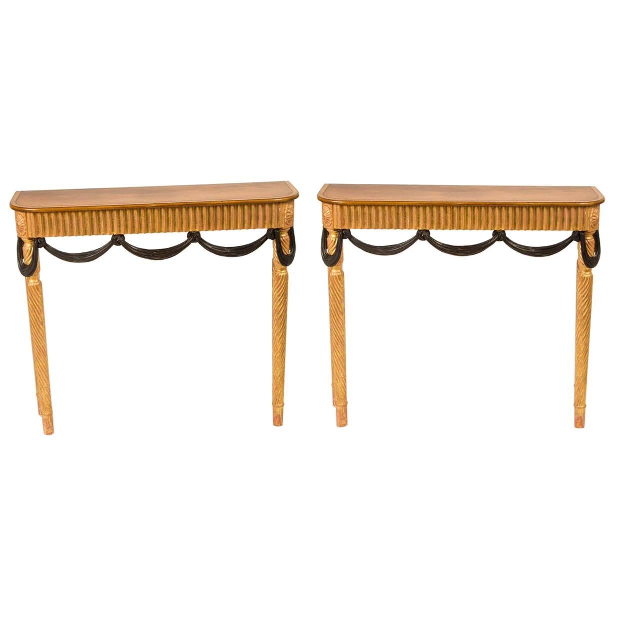 Pair of Italian Neoclassical Style Giltwood and Ebonized Consoles