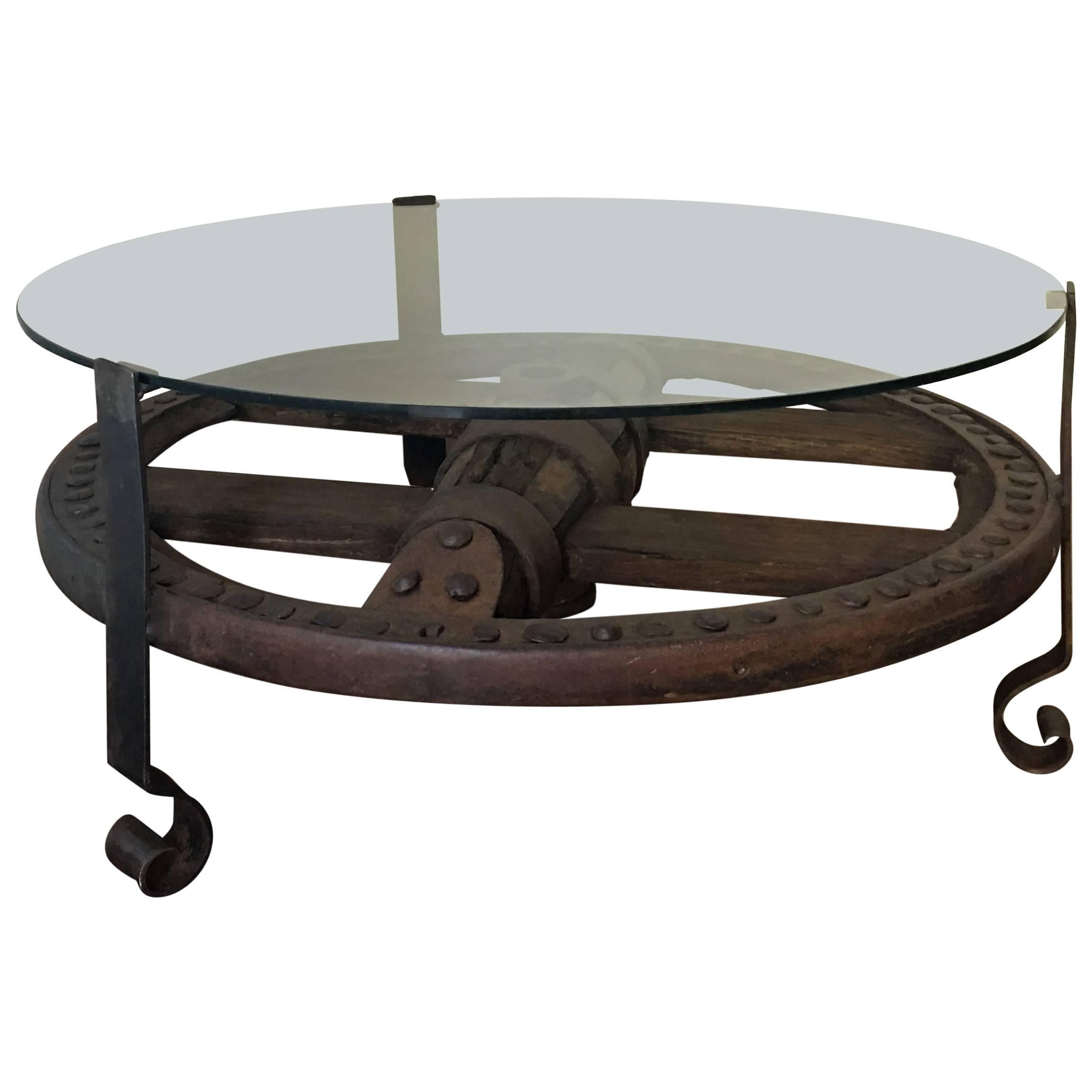 Wooden Wagon Wheel Indutrial Accent Spanish Table with Glass Top  For Sale