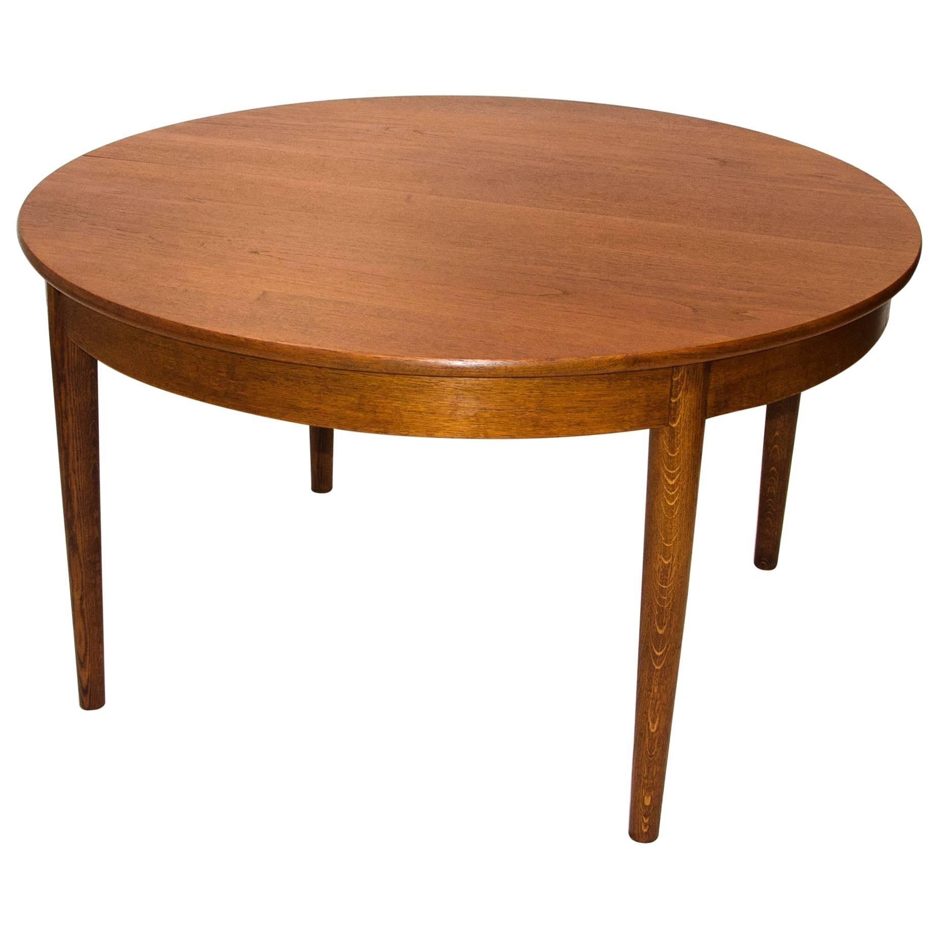 Danish Round Teak Dining Table with Four Skirted Leaves by Johannes Hansen