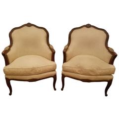Pair of 19th Century Louis XV Carved Walnut Bergeres