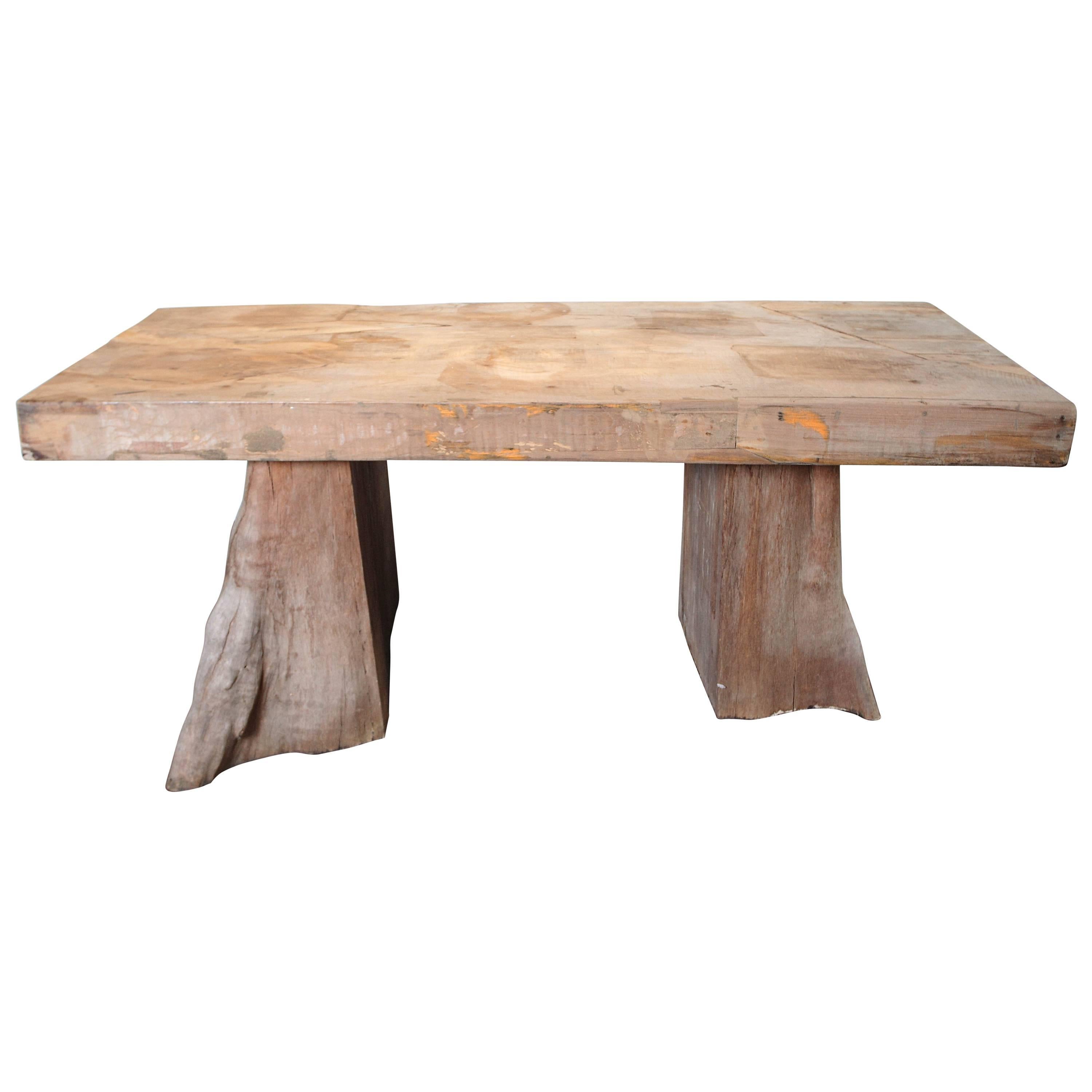 Slab top teak dining table with organic base supports accommodates four to six chairs.
For indoor or outdoor use. Exposed to the sun, teak will  bleach to a greyed white color. Teak is a weather resistant, and bug resistant hard wood.



         