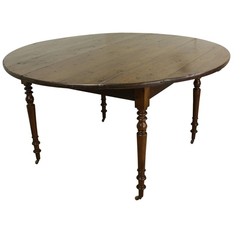 Round Laburnum Dining Table, Turned Legs on Castors at 1stDibs