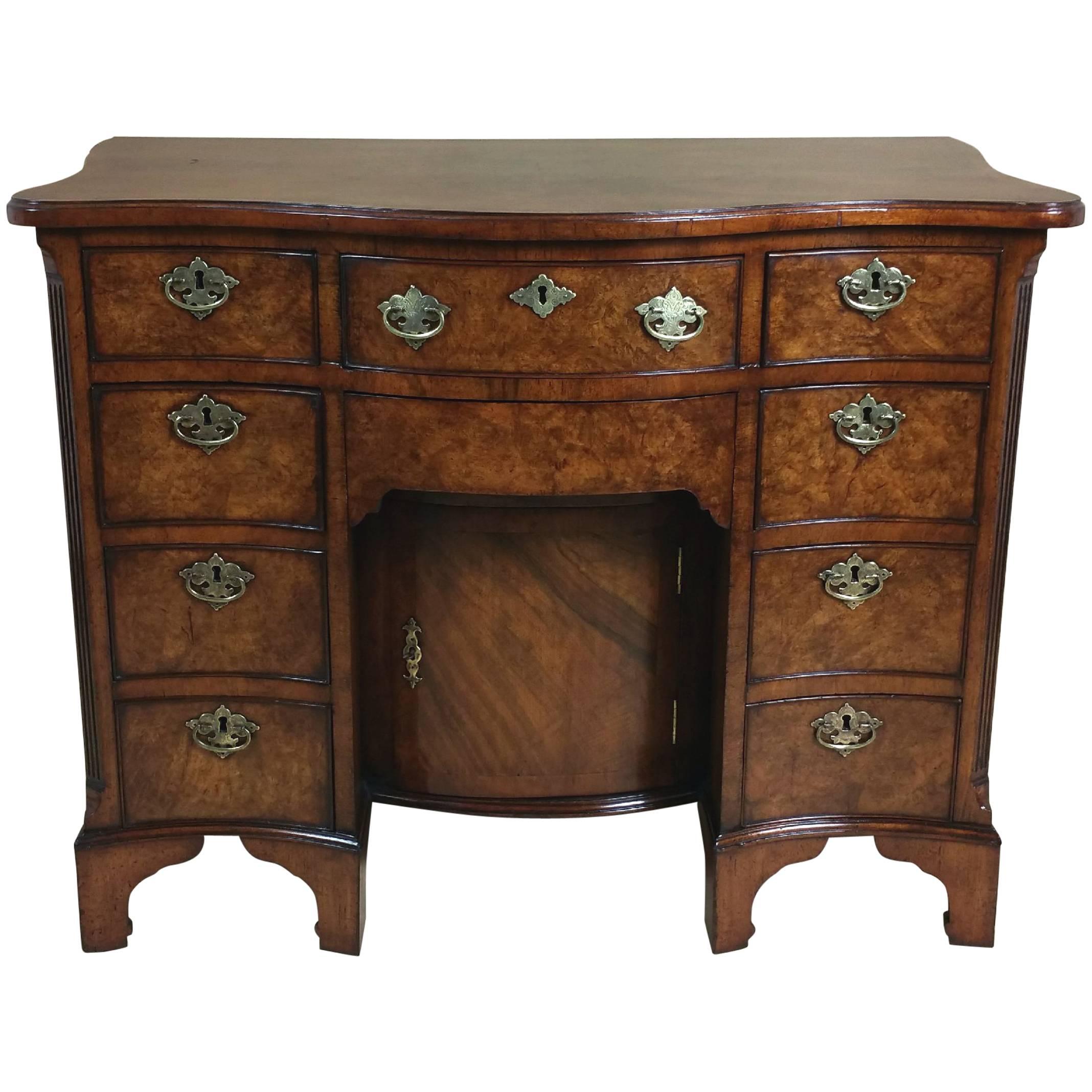 Late 19th Century Figured Walnut George I Style Serpentine Shaped Kneehole Desk