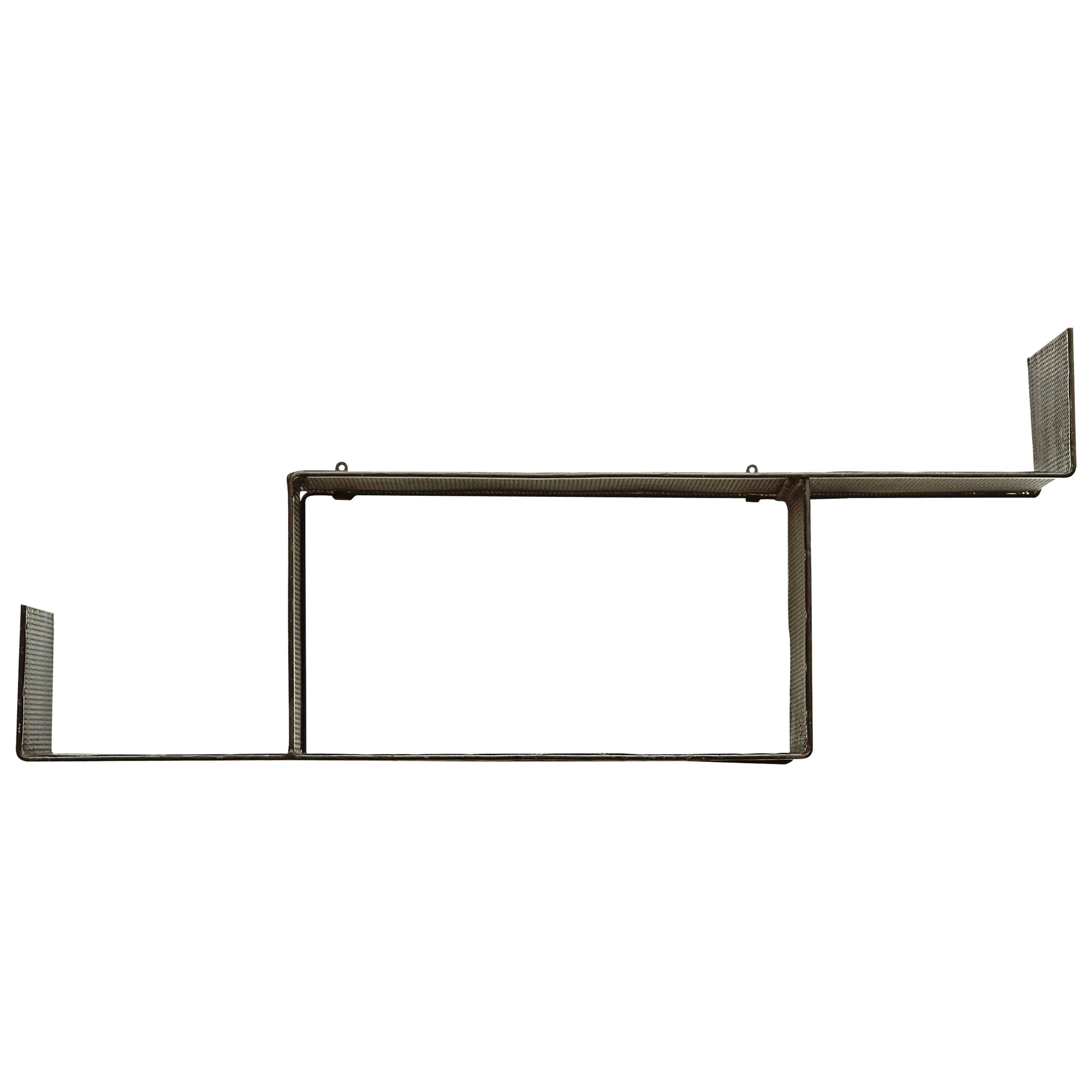 Shelve designed by Mathieu Matégot.
Manufactured but ateliers Matégot (France), circa 1950.

Perforated metal.

In good original condition, with minor wear consistent with age and use, preserving a beautiful patina.

Mathieu Matégot