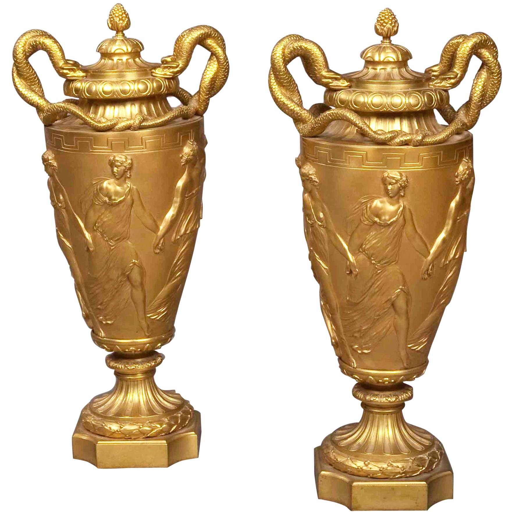 Pair of French Gilt Bronze Urns with Classical Italian Scenes