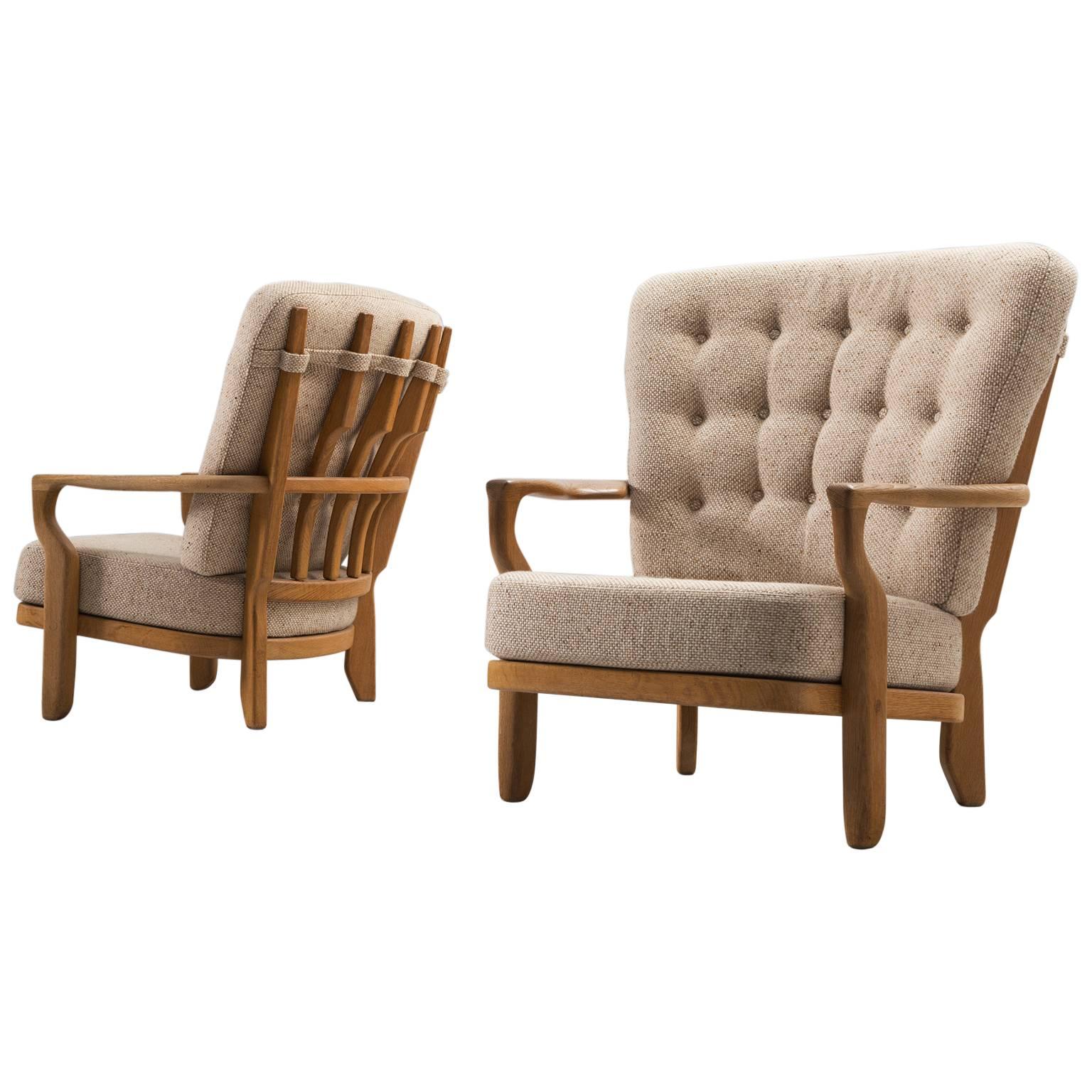 Guillerme & Chambron Set of Two Lounge Chairs in Solid Oak