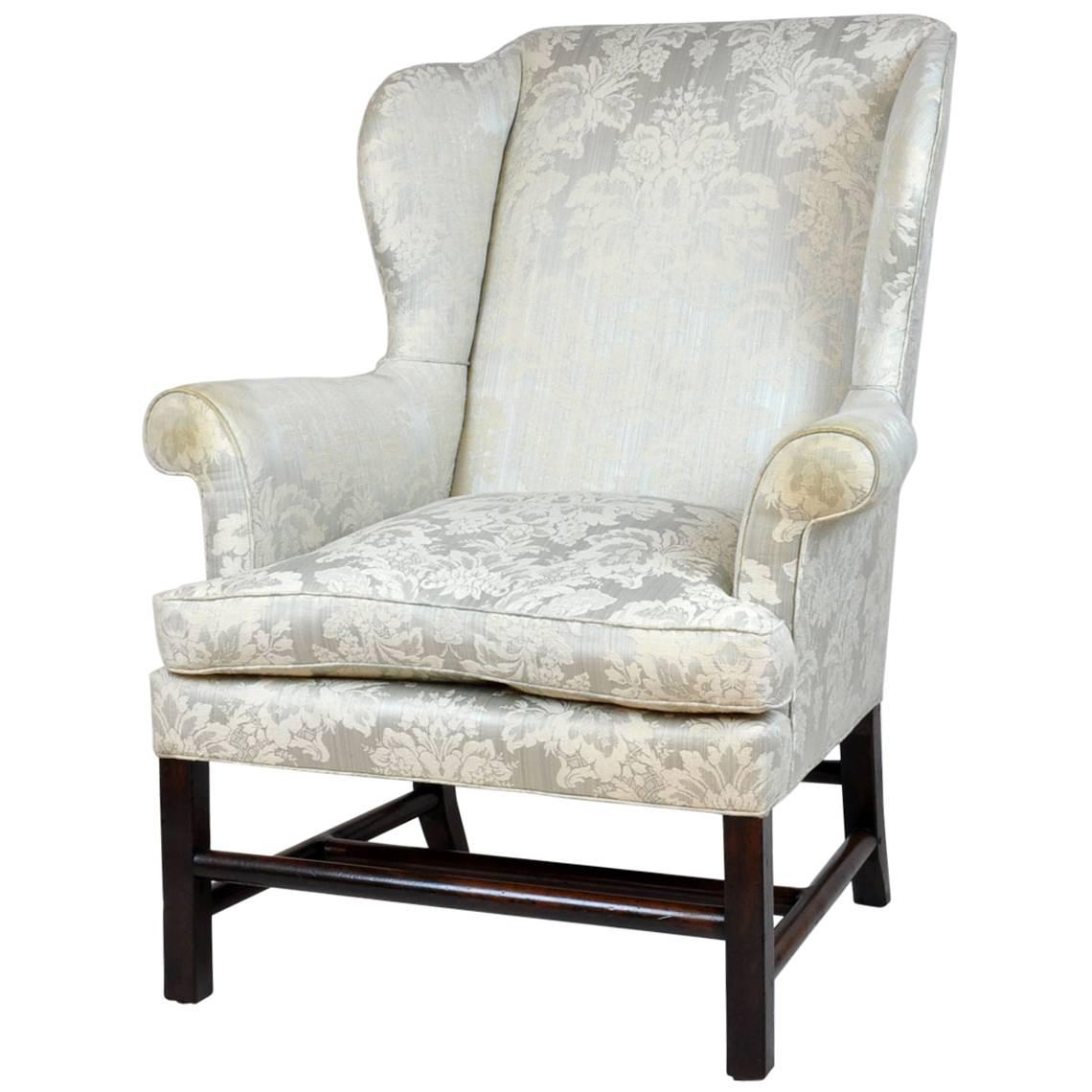 Georgian English Rolled Arm Wing Chair with Unusual Turned Stretcher, 1790s