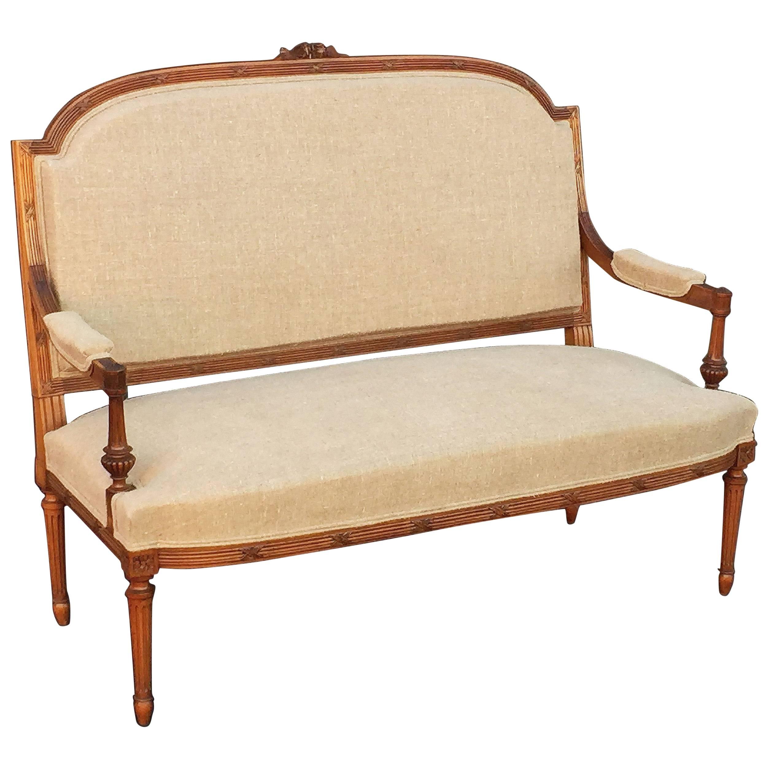 French Upholstered Settee of Carved Walnut