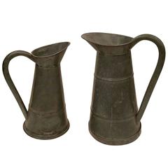 Two Large Antique Metal Pitchers