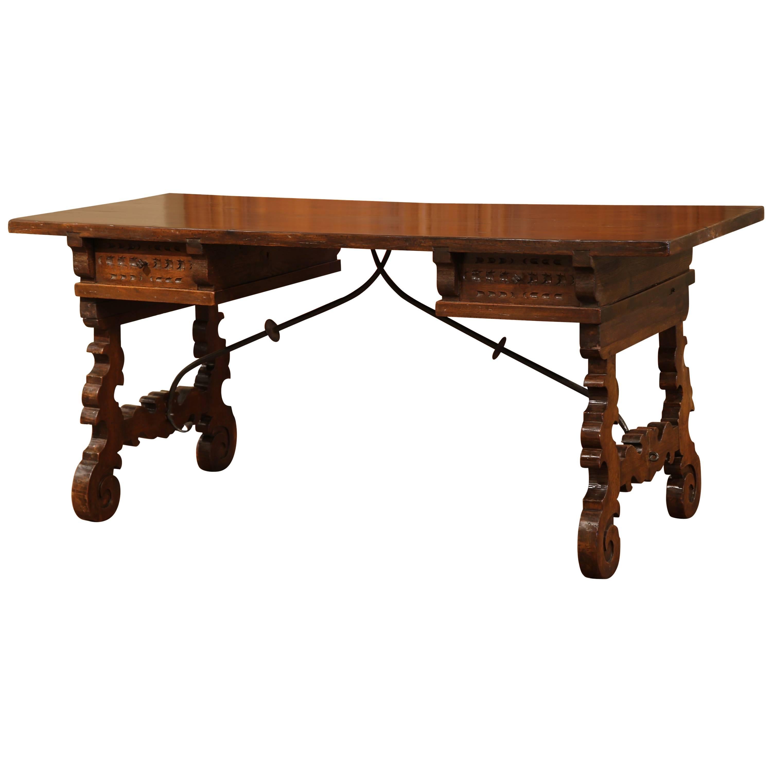 Early 20th Century Spanish Carved Walnut Desk with Wrought Iron Stretcher