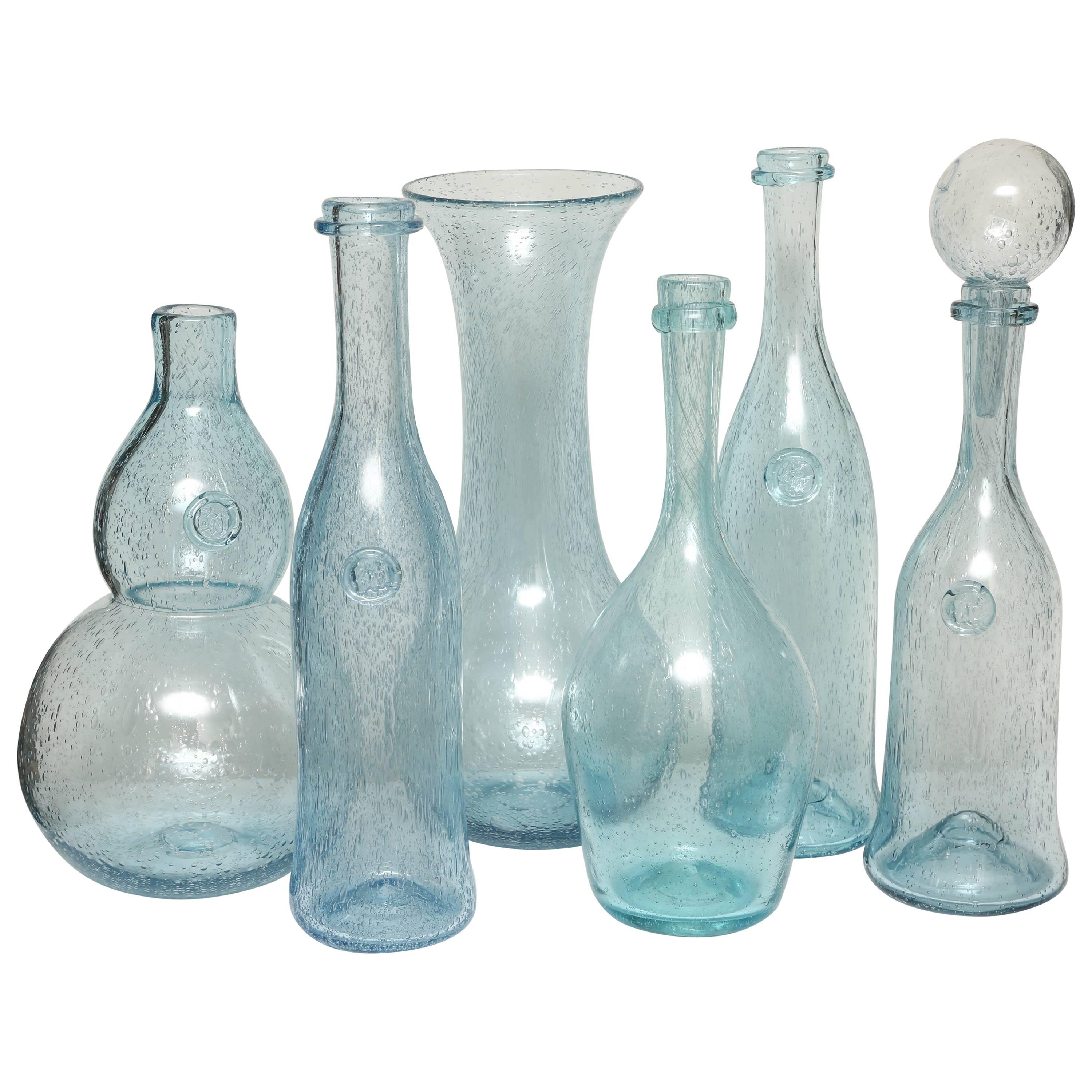 A Group Of Coloured Glass Bottles at 1stDibs