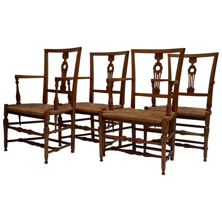 Set of Four Wicker Arm Chairs For Sale at 1stDibs