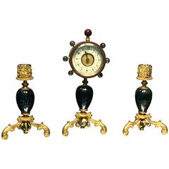 Antique Glamorous Suite of Semiprecious Stone and Doré Bronze Clock and Candlesticks