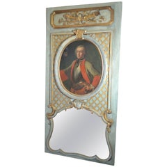 Miroir Trumeau du 19ème siècle doré à la feuille et peint avec portrait du 17ème siècle