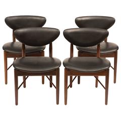 Set of Four Finn Juhl NV55 Dining Chairs in Rosewood and Black Leather, 1950s