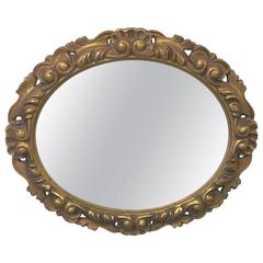 Oval Gilt Mirror with Heavy Detailing