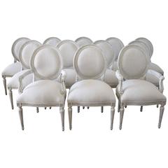 Set of 12 French Louis XVI Style Dining Chairs Upholstered in Natural Linen