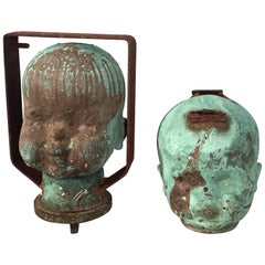 Two Verdigris Bronze Doll Head Molds