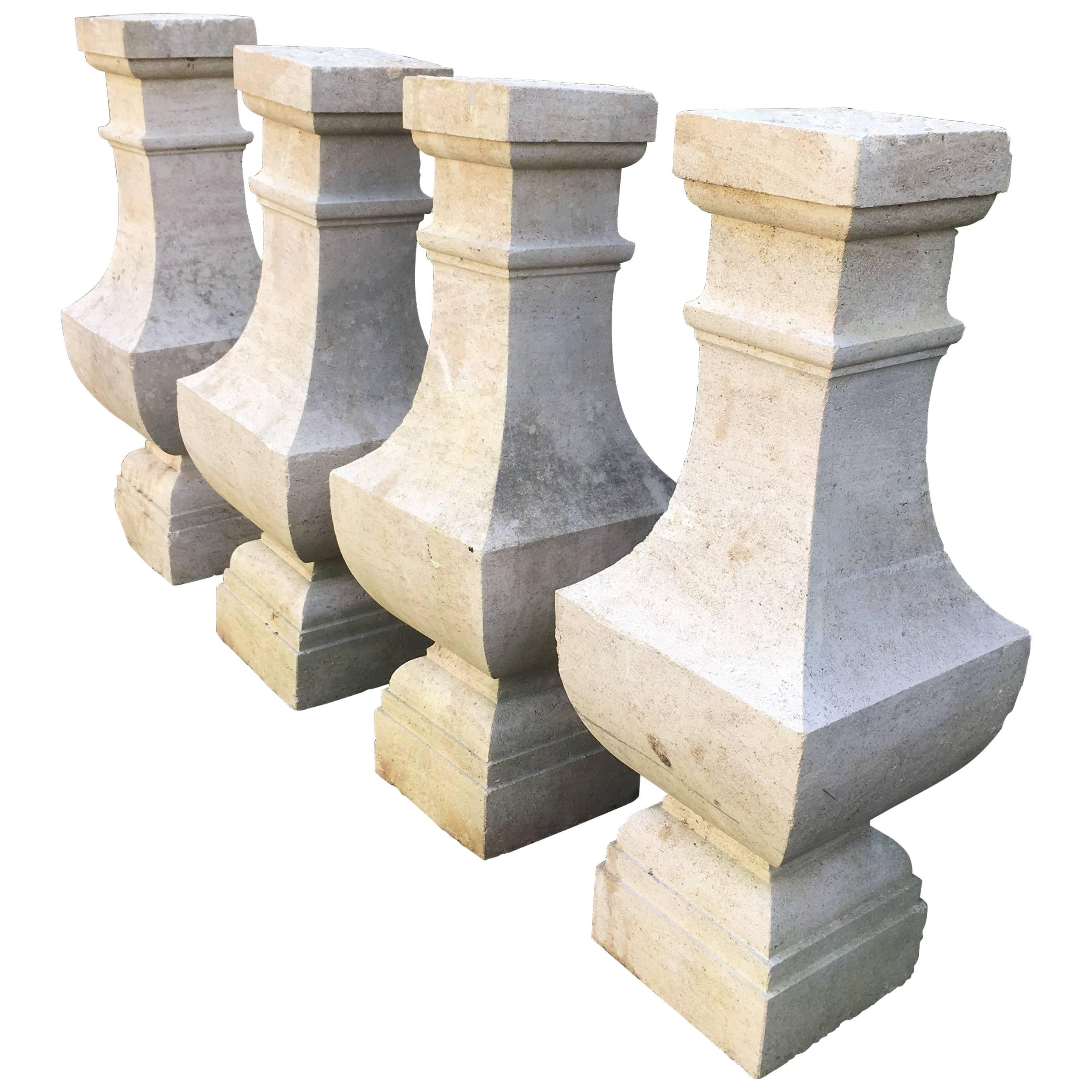 Two Pairs of Carved Limestone Balusters with Provenance