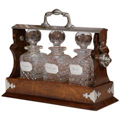 Antique 19th Century English Oak and Silver Plated Tantalus with Crystal Decanters