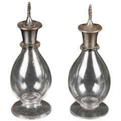 Greenwood and Watts. A Pair of Gothic Revival Silver Mounted Glass Decanters.