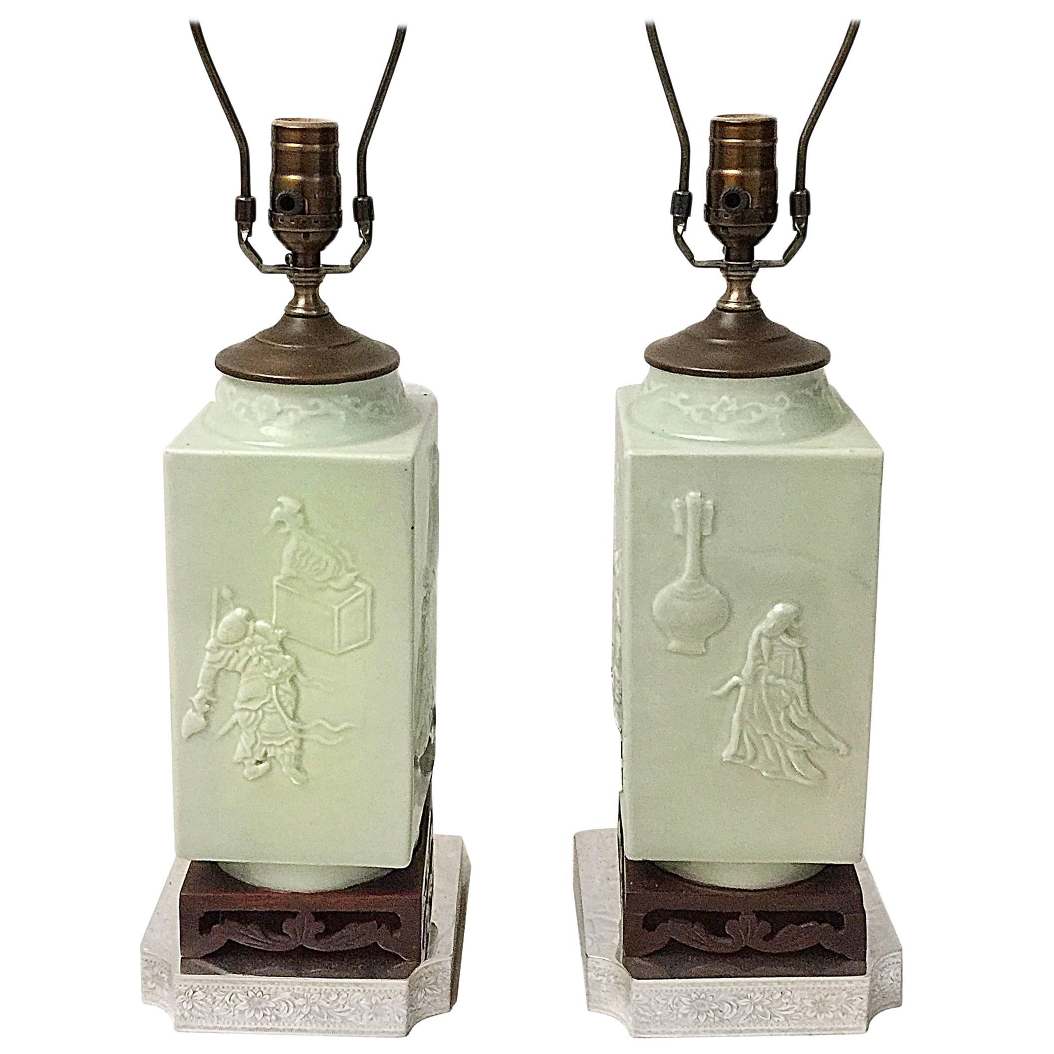 Pair of 1920s Chinese celadon lamps with court scenes, silver plated bases.

Measures: 15