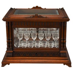 Exceptional Baccarat Cave à Liqueurs with Original Labels in Carved Oak Case