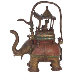 Pichet à eau artisanal ancien en bronze représentant un éléphant et un cavalier