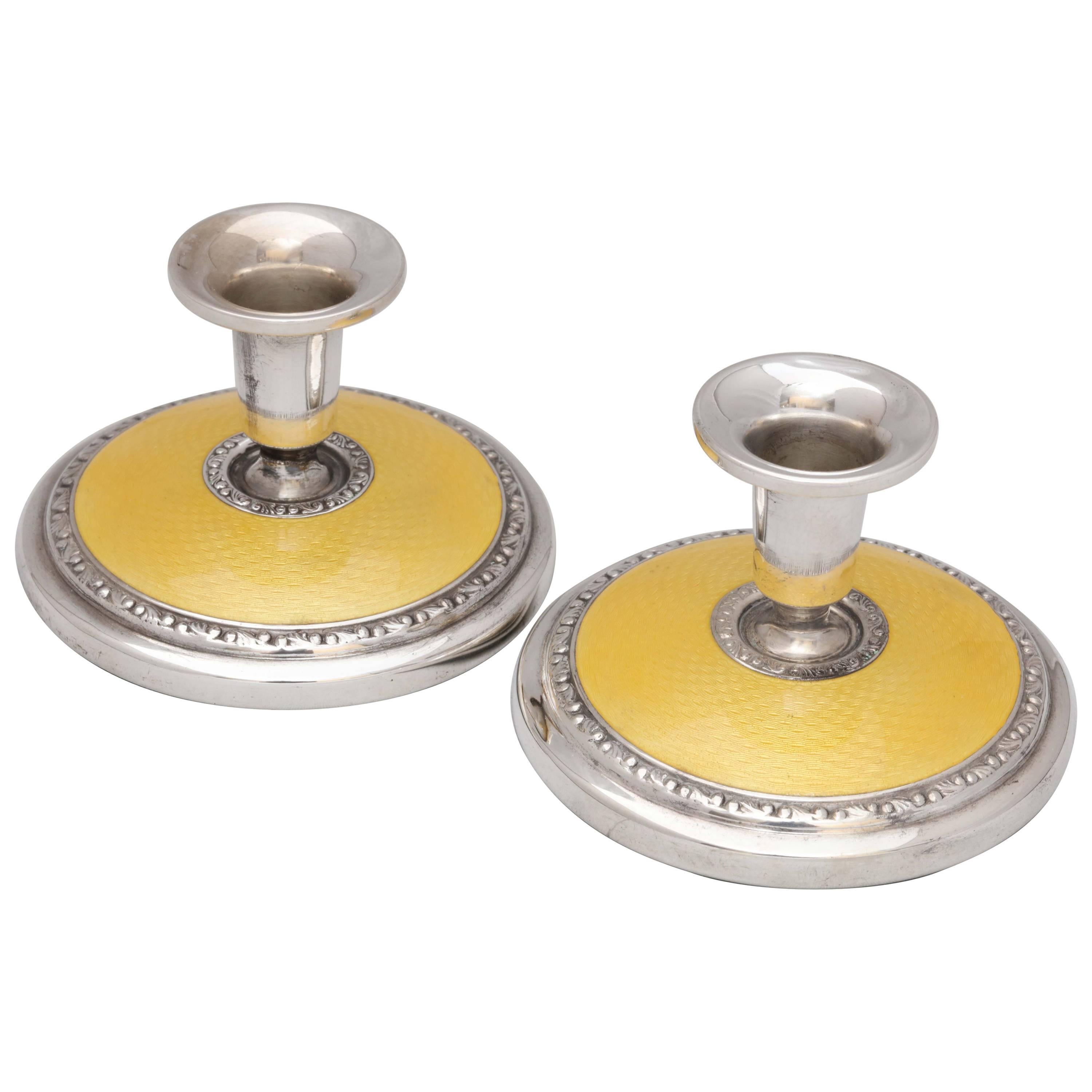 Pair of Art Deco Sterling Silver and Yellow Guilloche Enamel Candlesticks