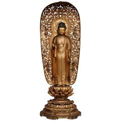 Figure de Bouddha en bois sculpté japonais du 19ème siècle avec laque dorée sur pied